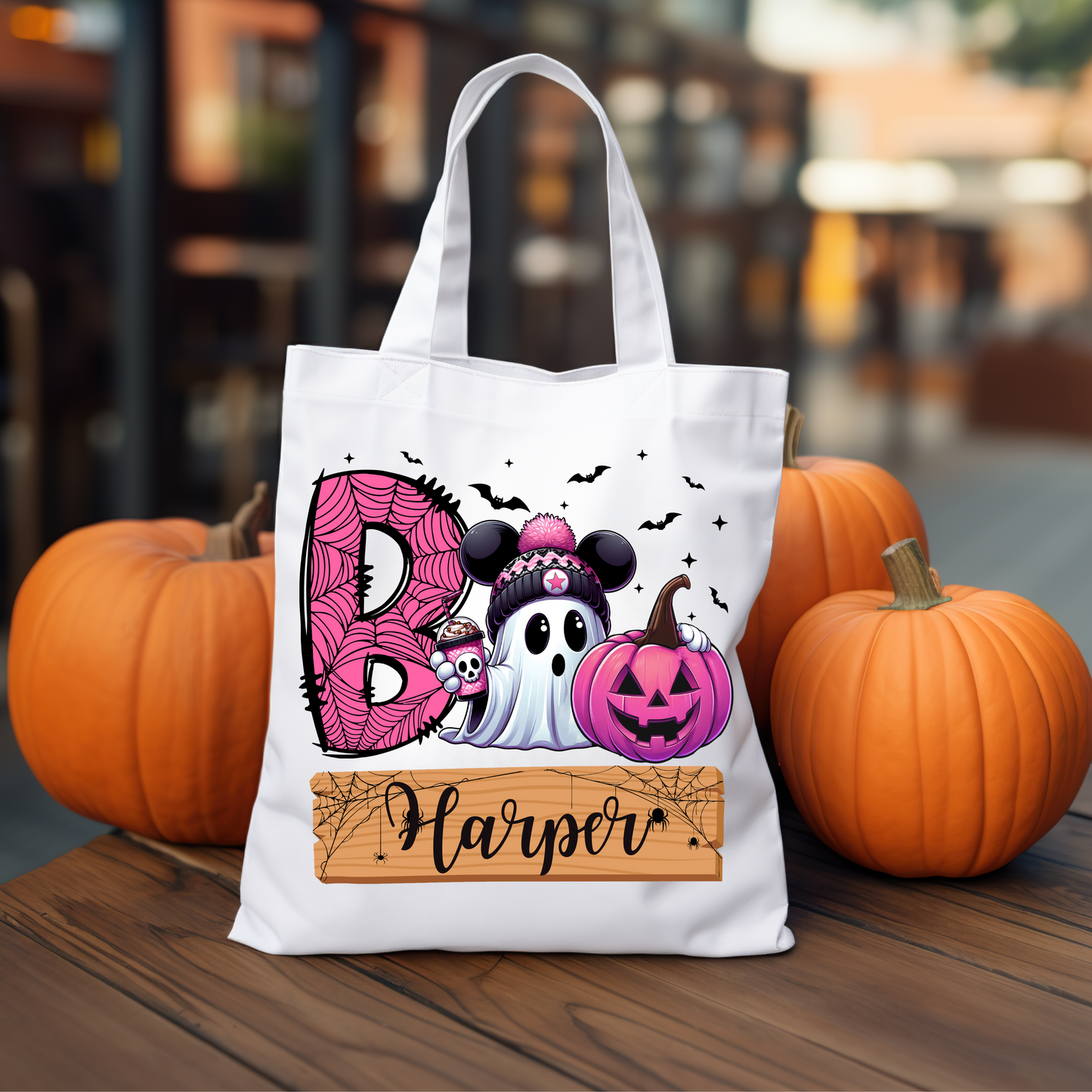 Personalized "Boo! Cute Ghost with Iced Coffee" trick-or-treat tote bag featuring a whimsical ghost design, perfect for collecting candy during Halloween festivities.