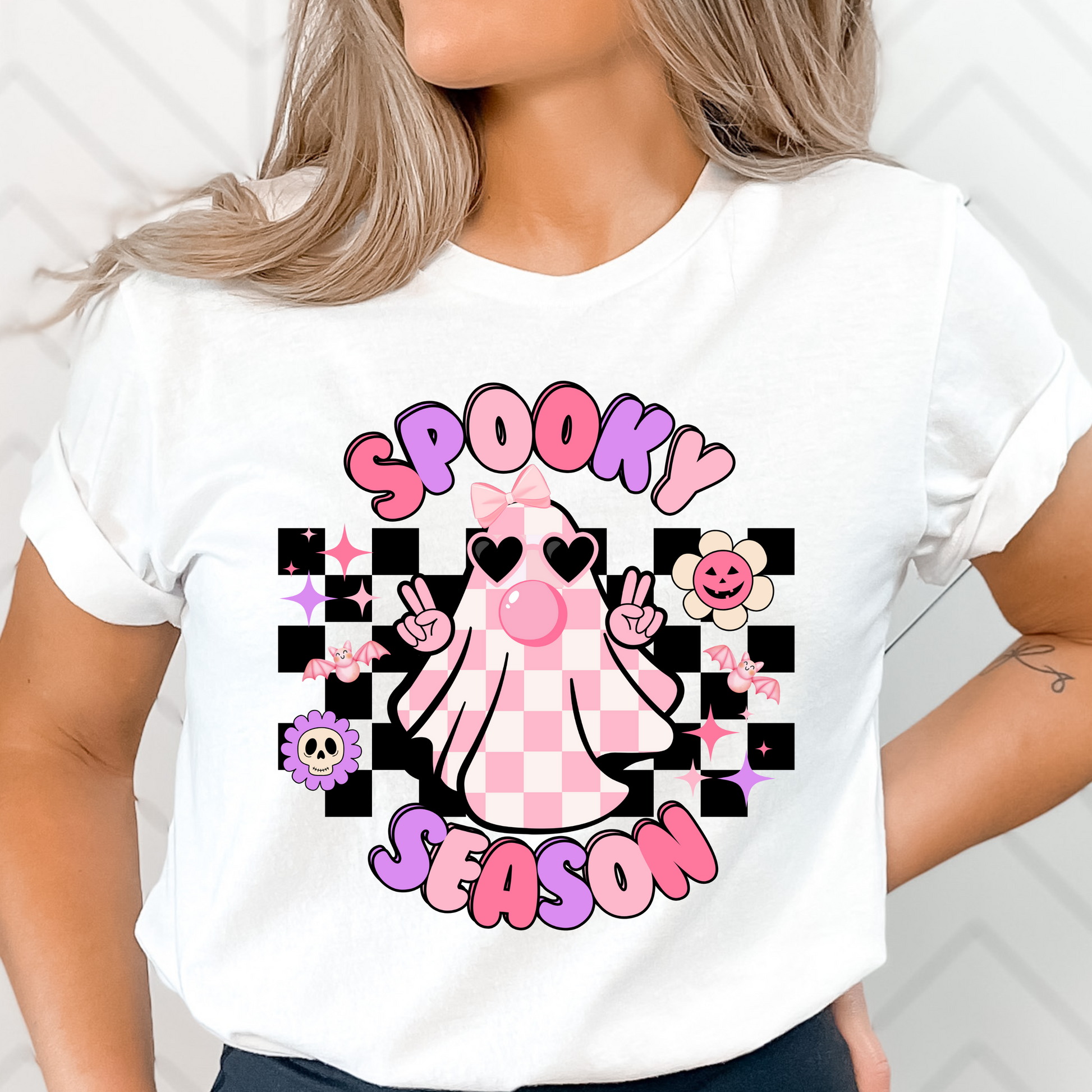 Spooky Season pastel pink checkered ghost Halloween shirt for women, featuring a cute ghost design on a trendy pink background. Fun and stylish Halloween tee.