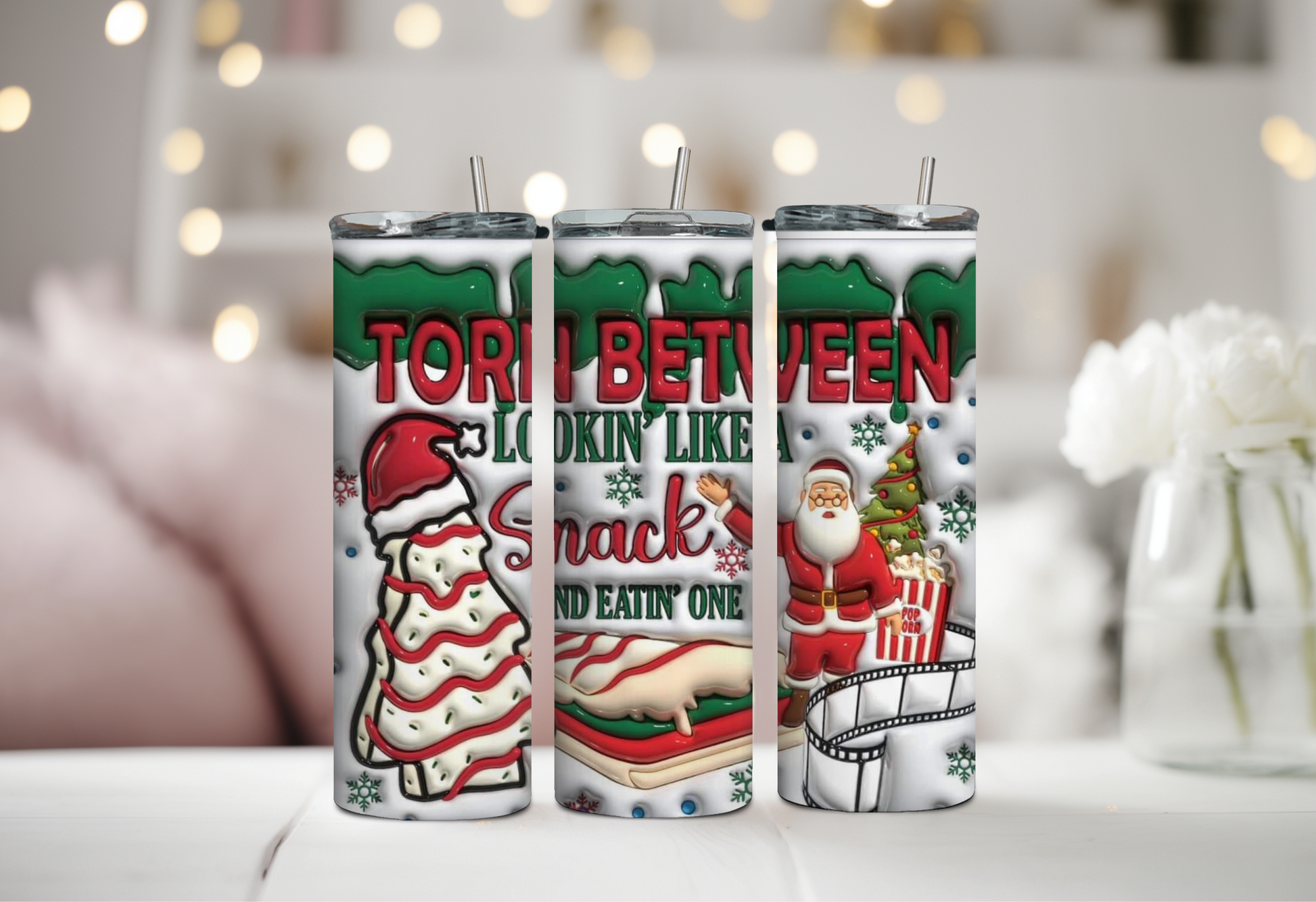 Christmas-themed tumbler featuring Christmas Tree Cakes, Santa Claus, and popcorn with the humorous phrase "Torn Between Lookin' Like a Snack and Eatin' One," 20oz insulated drinkware for holiday fun.