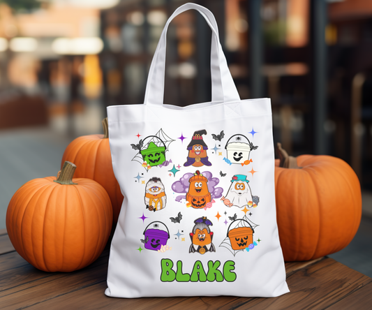 Nostalgic Halloween tote bag featuring cute chicken nugget characters dressed in Halloween costumes. Customizable with a name or message, perfect for trick-or-treating or everyday use.