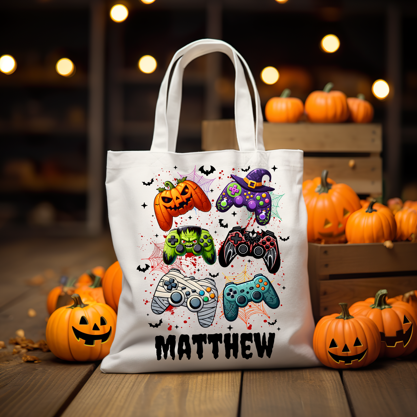 Personalized Halloween gamer tote bag featuring colorful game controllers dressed in Halloween costumes, perfect for trick-or-treating, with customizable name option.