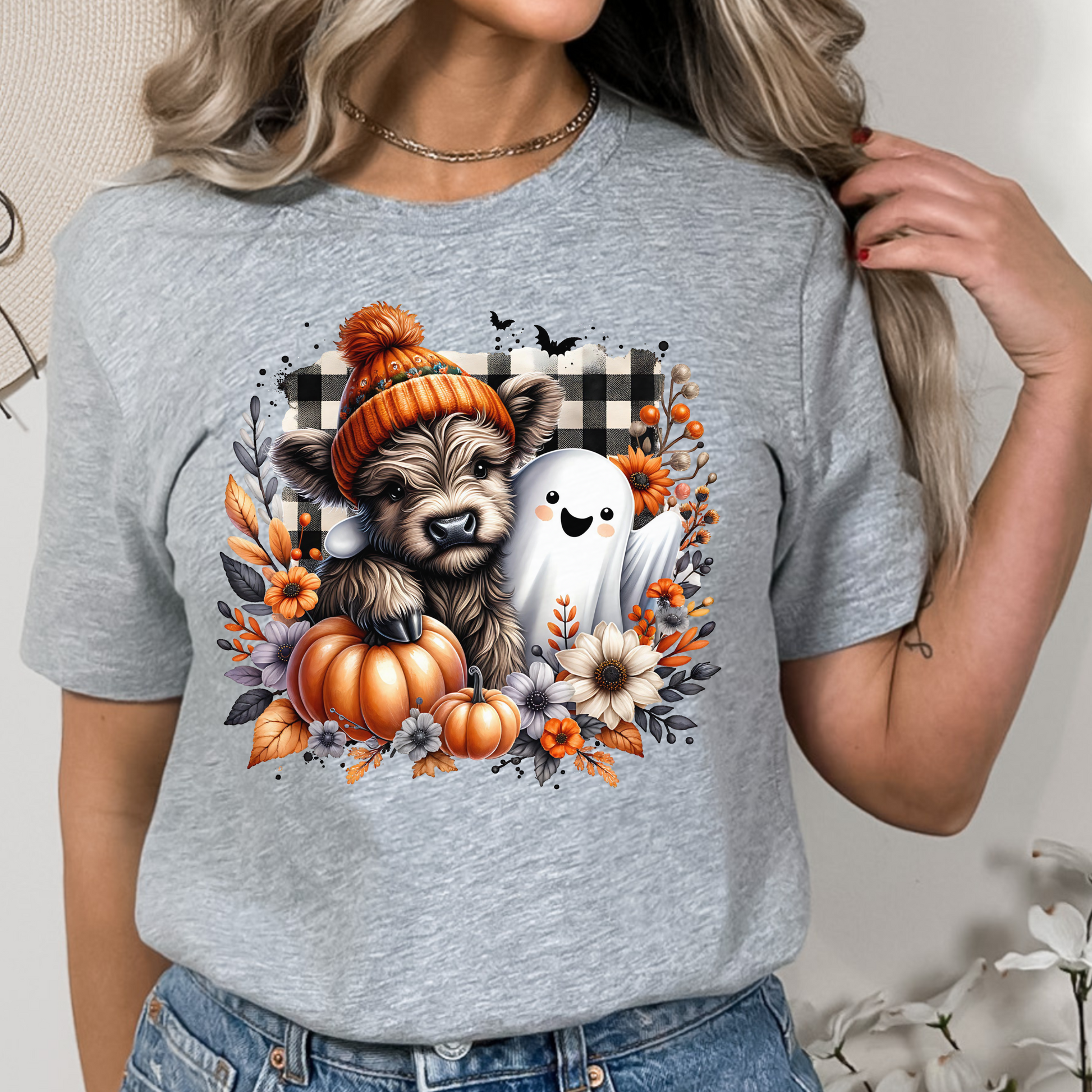 Halloween Buffalo Plaid Highland Cow & Ghost T-Shirt in a farmhouse style with a buffalo plaid headband and a smiling ghost, ideal for fall and Halloween celebrations.