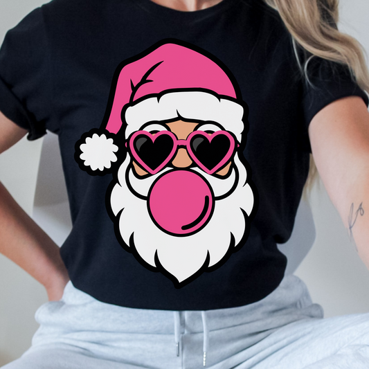 Unisex t-shirt with a pink retro Santa design featuring heart-shaped sunglasses and blowing a bubblegum bubble