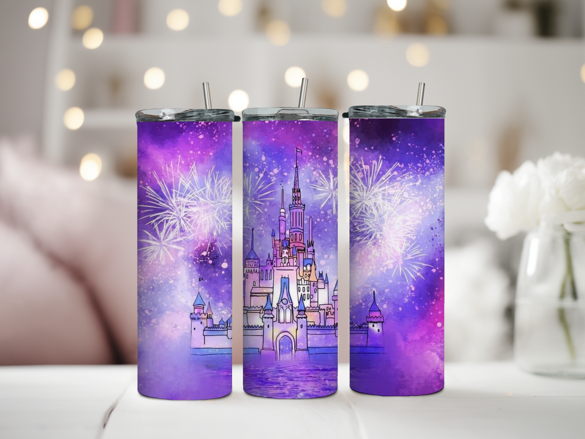 20oz Skinny Tumbler featuring a magical castle illustration with vibrant fireworks in a dreamy purple sky. Stainless steel tumbler with double-wall vacuum insulation, perfect for keeping drinks hot or cold. Includes spill-resistant lid and reusable straw. Ideal for Disney lovers, fantasy fans, and adding enchantment to your daily routine.