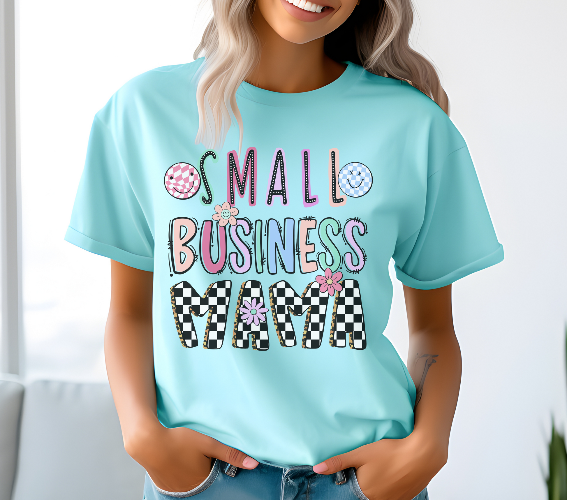 Small Business Mama Retro Daisy Unisex Shirt. Features a retro daisy graphic with the text 'Small Business Mama,' celebrating entrepreneurial pride. Soft cotton material in a unisex fit, available in various colors. Ideal for casual wear, business events, and as a gift for mompreneurs. Machine washable for easy care.