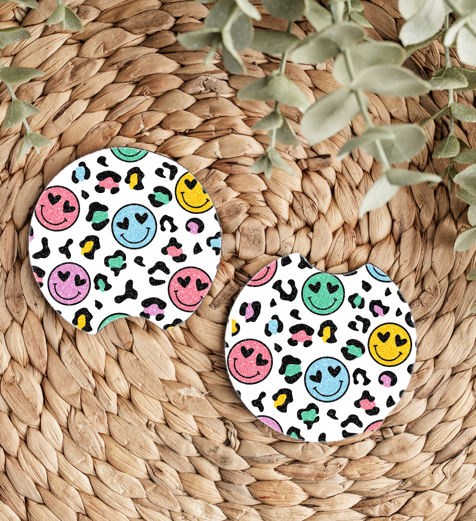 Transform your car’s interior with these vibrant Smiley Face Car Coasters! Designed to keep your cup holders clean and dry, these coasters add a fun and stylish touch with their cheerful smiley faces and colorful leopard print background. Perfect for anyone looking to add personality and positivity to their ride.